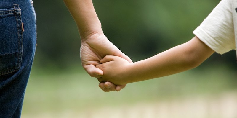 mother and child holding hands