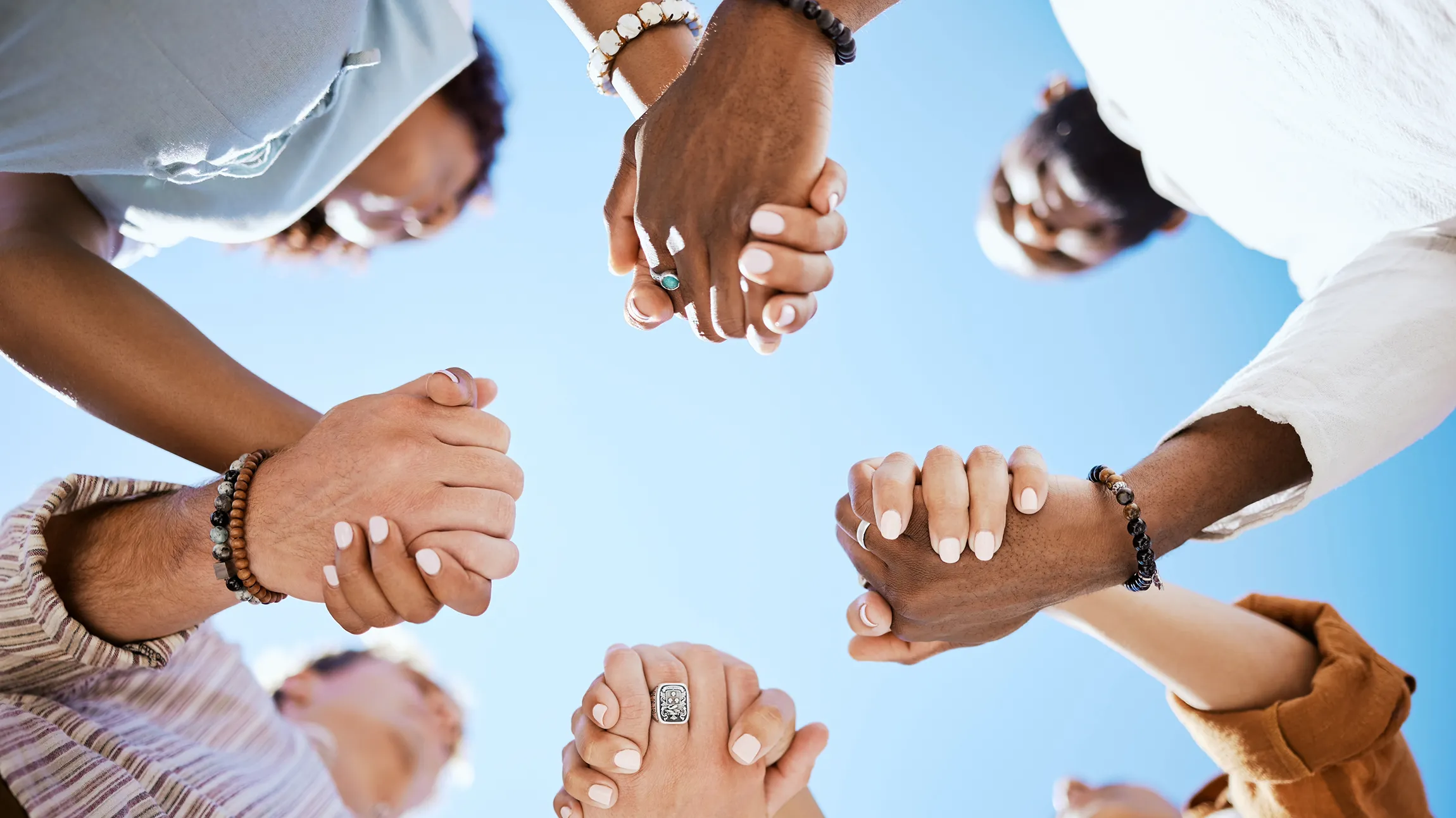 Friends joining hands